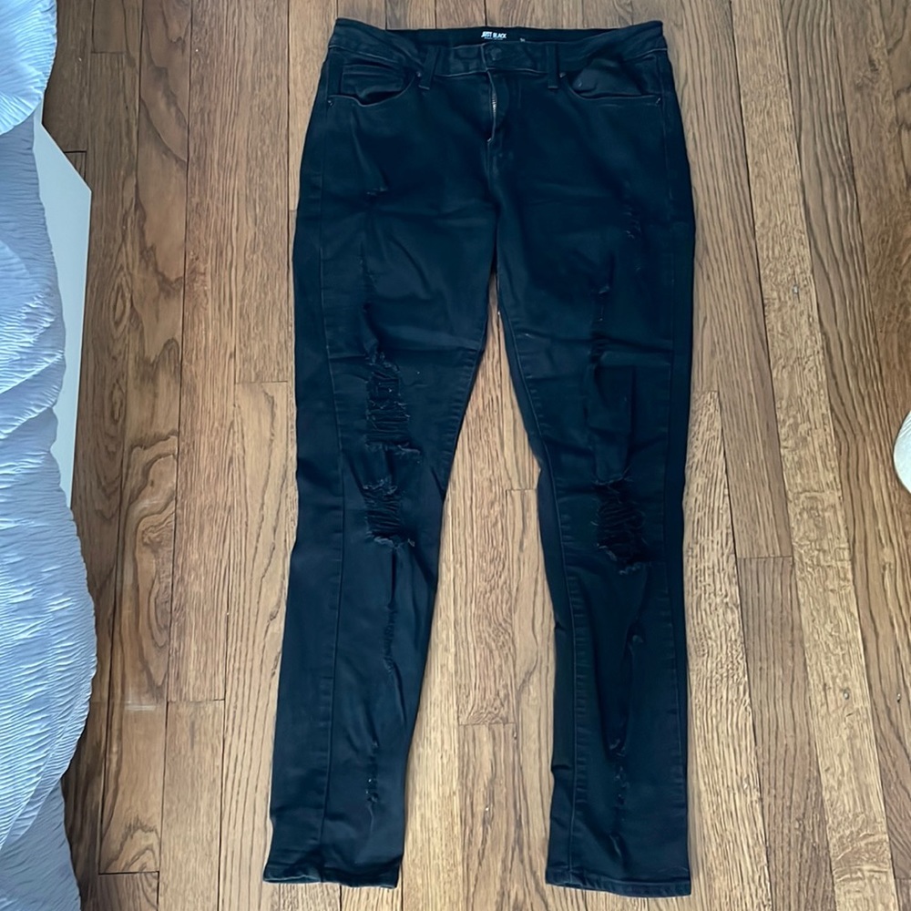 Black ripped jeans.